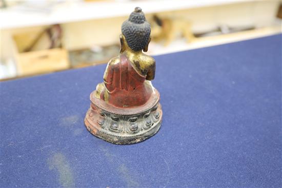 A Sino-Tibetan gilt and polychrome bronze seated figure of Buddha Shakyamuni, 17th/18th century, H. 16.5cm